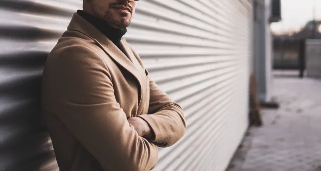 a professional man with his arms crossed