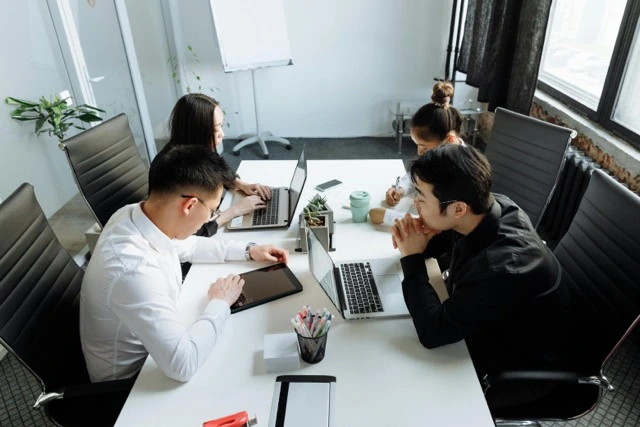 group of people having a meeting in the office